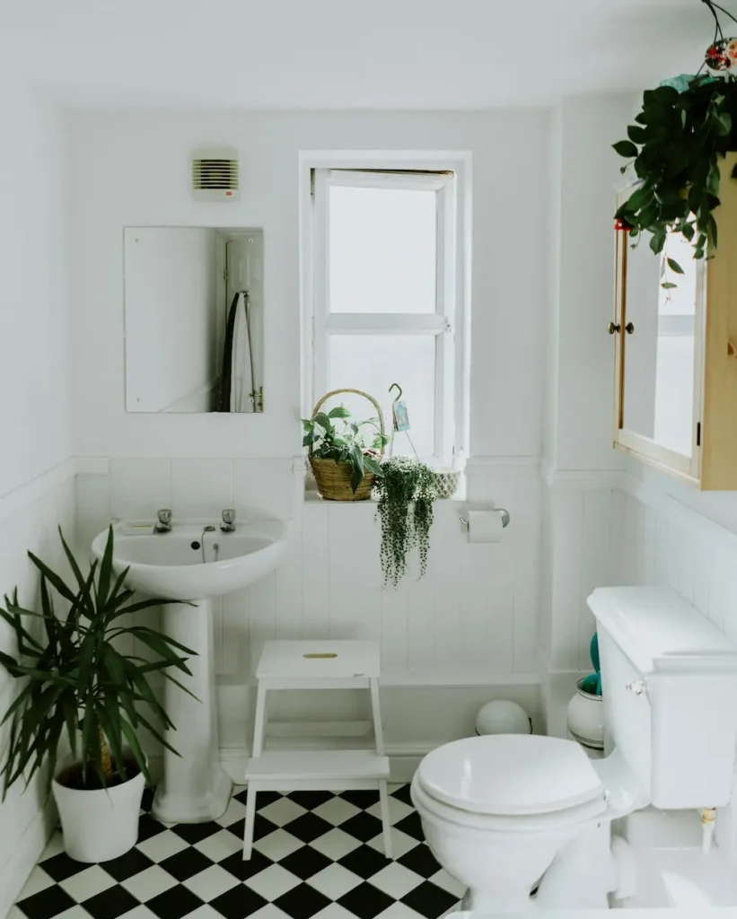 Outdated bathroom with worn flooring and dated fixtures, the kind of problem we fix in Burlington