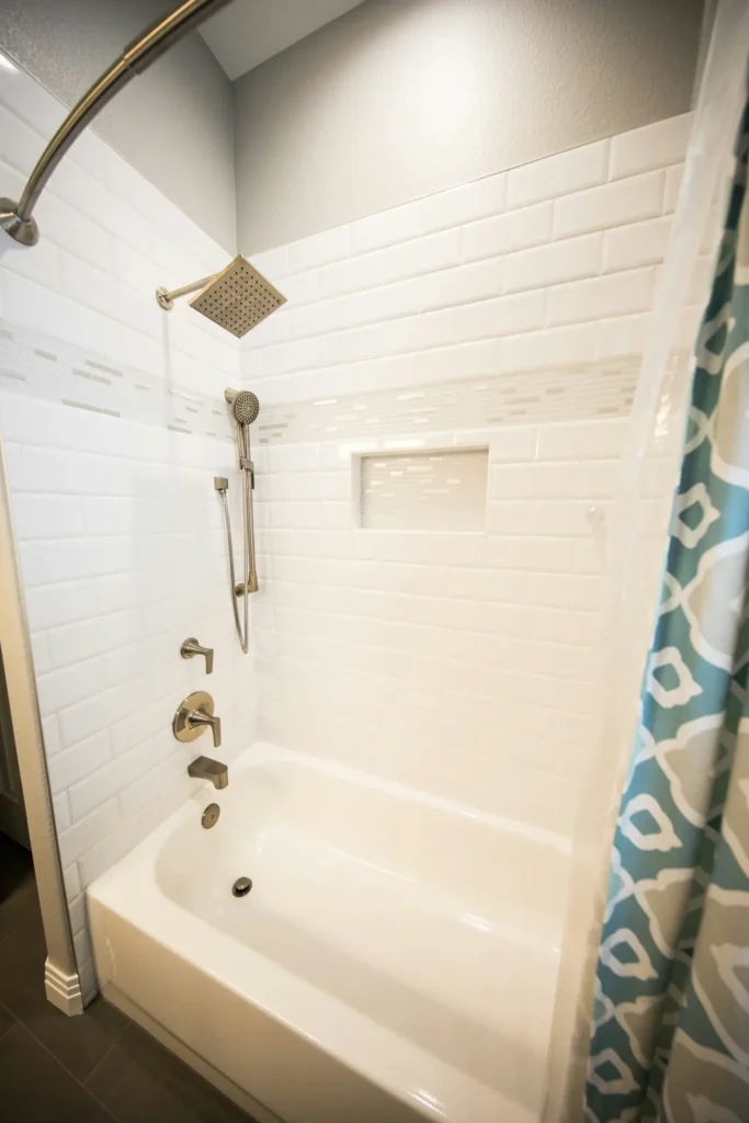 Standard tub-and-shower combo with a high step-over wall — a common accessibility challenge in older Burlington bathrooms
