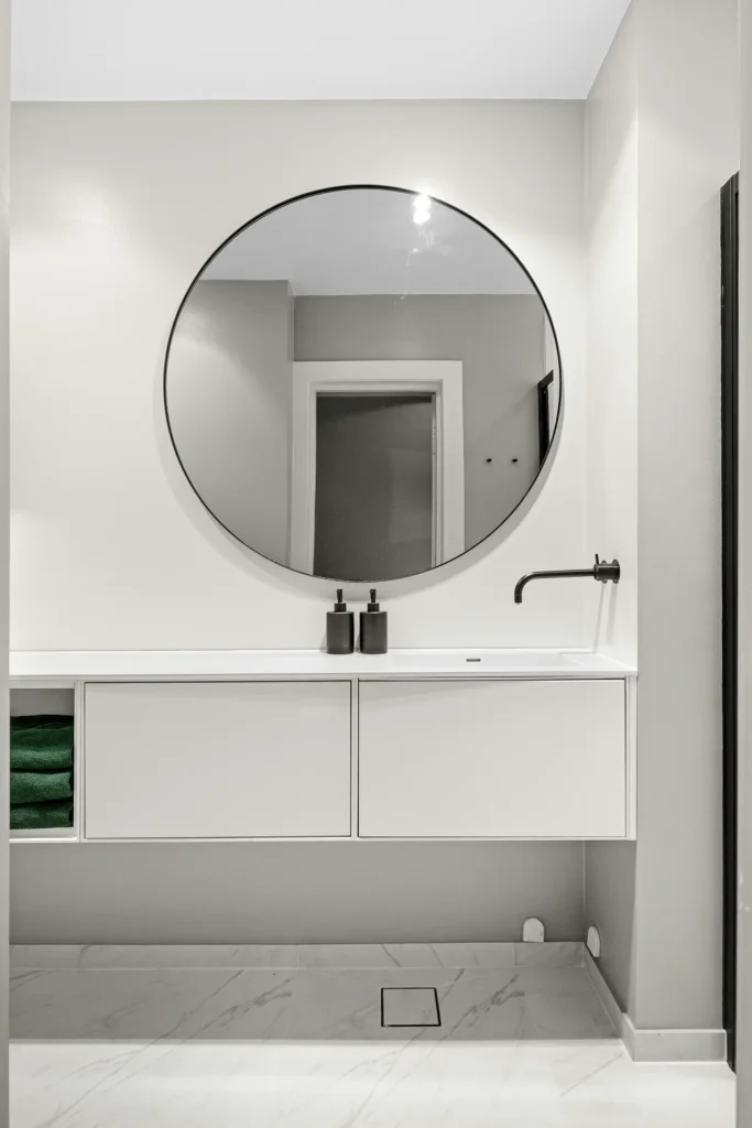 Wall-mounted bathroom cabinet with organized storage in Burlington